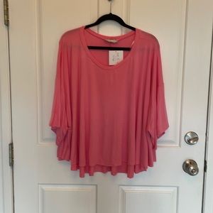 Pink shirt for a comfortable look.